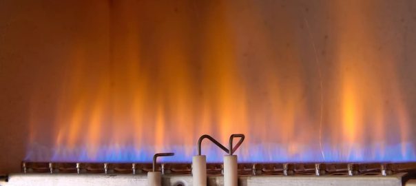 Flames inside a lit gas furnace